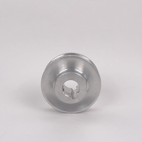 Single tension pulley for strapping machine