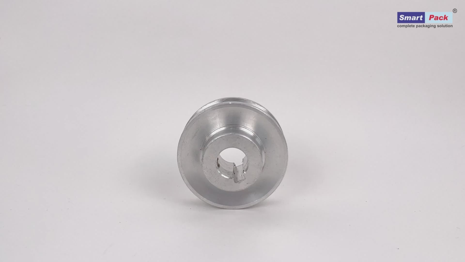 Single tension pulley for strapping machine